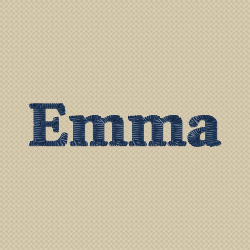 El nombre Emma bordado con hilo azul marino sobre tela beige